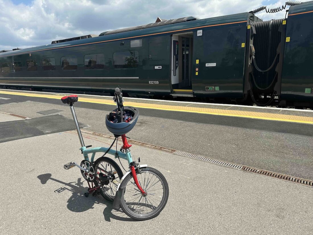 Brompton bike in front of the train in Oxford station.