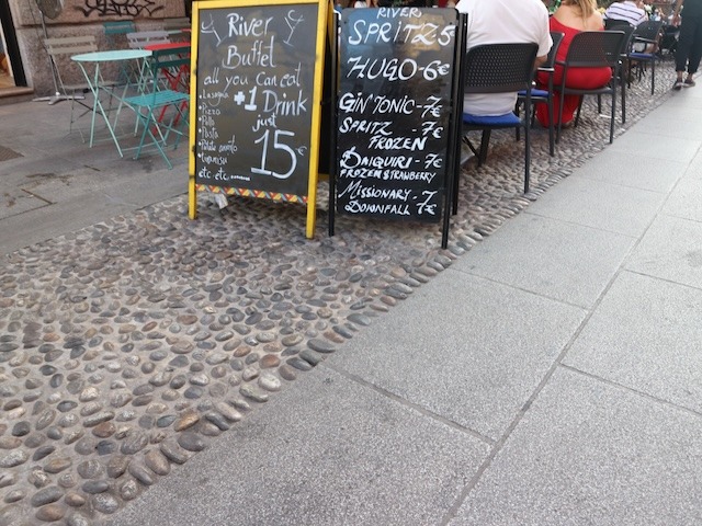 Happy hour signs in Navigli district Milan.